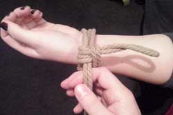 bondage rope on hand